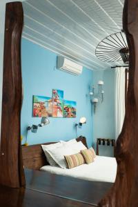 Favela Living Space客房内的一张或多张床位