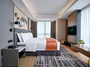 广州南湖假日酒店客房内的一张或多张床位