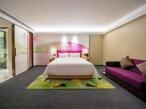 广州白云机场北希尔顿欢朋酒店Hampton by Hilton Guangzhou Baiyun Airport North客房内的一张或多张床位
