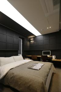 boutique hotel k Dongdaemun客房内的一张或多张床位