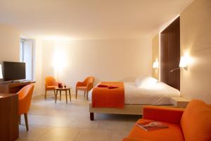 Hotel Le Clos De La Vouge客房内的一张或多张床位