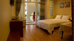 湄公河樱桃酒店客房内的一张或多张床位