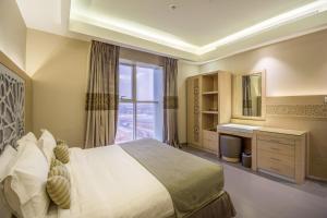 Ewaa Express Hotel - Al Hamra客房内的一张或多张床位