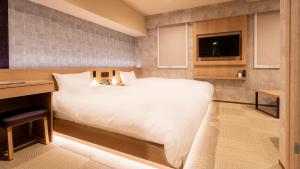 Galois Hotel Shinokubo客房内的一张或多张床位