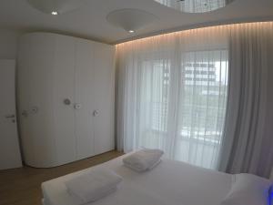 Marina Verde Resort Official客房内的一张或多张床位