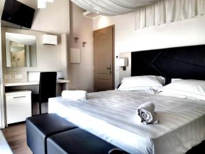 Hotel Boutique Castiglione del Lago客房内的一张或多张床位