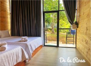 Homestay De la Rosa - Côn Đảo客房内的一张或多张床位