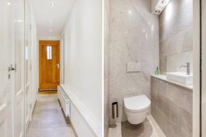 阿姆斯特丹Artis Plantage Apartment的白色的浴室设有卫生间和水槽。