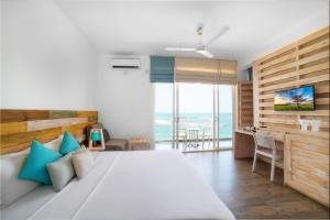 希克杜沃海滩酒店客房内的一张或多张床位