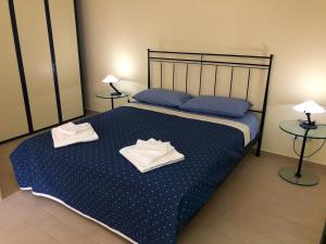 Capo Taormina House客房内的一张或多张床位