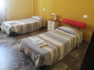 Molise Inn - Bed & Breakfast Campobasso Centro客房内的一张或多张床位
