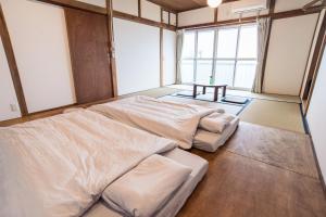 Saitosyukuba客房内的一张或多张床位