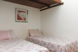 Ipanema Sunset Apartment客房内的一张或多张床位