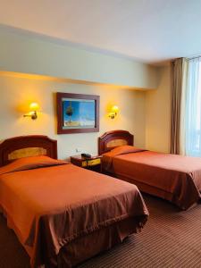欧陆利马酒店客房内的一张或多张床位