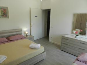 Appartamenti Via Cortonese 1客房内的一张或多张床位