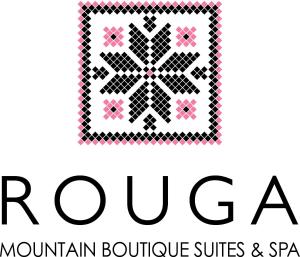 帕雷斯阿吉萨那ROUGA Mountain Boutique Suites & Spa的 ⁇ 卡山精品套房和spa标志的被子