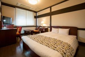 
Wasuki Tsukasakan日式旅馆客房内的一张或多张床位

