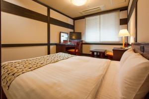 
Wasuki Tsukasakan日式旅馆客房内的一张或多张床位
