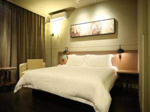 锦江之星品尚温州高铁南站新桥酒店客房内的一张或多张床位
