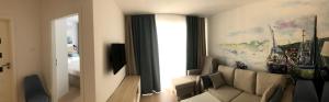 Nadmorskie Tarasy Apartament 312的休息区