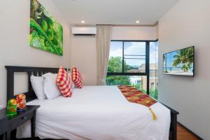 The Title Rawai Beach West Wing客房内的一张或多张床位