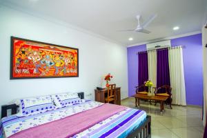 Vasudevam Premium Suites客房内的一张或多张床位