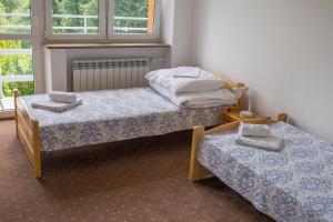 Dom Pszczelarza w Kamiannej客房内的一张或多张床位