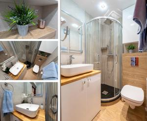 罗兹Apartament LILA的带淋浴、盥洗盆和卫生间的浴室