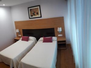 Hotel Alda Barraña Playa客房内的一张或多张床位
