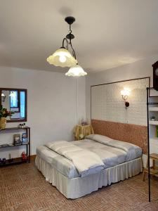 La Finestra Sui Cento Portali客房内的一张或多张床位