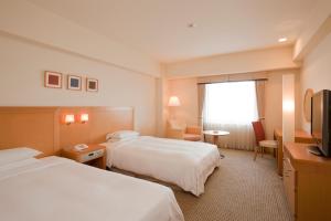 休伊特甲子园酒店客房内的一张或多张床位