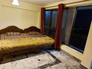 Shahrukh Heights客房内的一张或多张床位