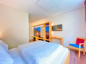 I AM HOTEL Graz-Seiersberg客房内的一张或多张床位