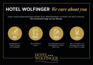 林茨Austria Classic Hotel Wolfinger - Hauptplatz的酒店志愿者的一套标志