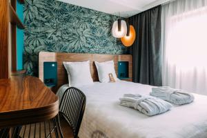 大洋洲巴黎凡尔赛门酒店客房内的一张或多张床位