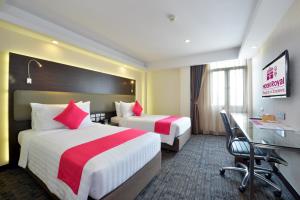 曼谷唐人街皇家酒店客房内的一张或多张床位