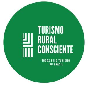 巴埃彭迪Fazenda da Roseta - Turismo Rural e Passeios a Cavalo -的绿色圆圈,带有读到金针状甲状腺的符号