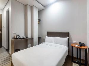 Airo Hotel Manila客房内的一张或多张床位