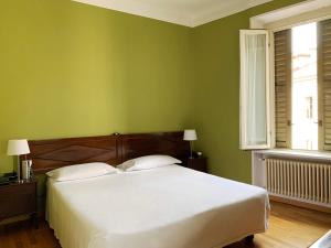 艾尔伯格博洛尼亚酒店客房内的一张或多张床位