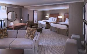 艾塔斯卡沉香度假酒店 的酒店客房,设有两张床和一张沙发