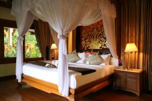 Khum Phaya Resort & Spa Boutique Collection客房内的一张或多张床位