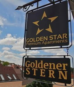 梅尔克GOLDEN STAR - Premium Apartments的金星白金公寓标志