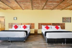 Capital O Hotel Posada Terraza, Tequila Jalisco客房内的一张或多张床位