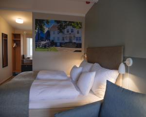 Strand Hotel Fevik - by Classic Norway Hotels客房内的一张或多张床位