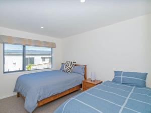 Peace and Paradise - Whitianga Holiday Home客房内的一张或多张床位