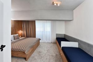 Apartmány Tri sestry - real SKI IN SKI OUT客房内的一张或多张床位