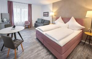 Excellentas Apartments Hannover客房内的一张或多张床位