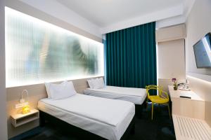 ibis Styles Dunarea Galati客房内的一张或多张床位