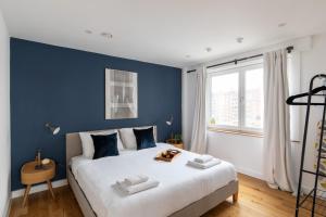 homely – Central London Luxury Apartments Camden客房内的一张或多张床位