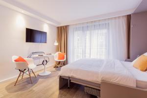 360 Apartment Hotel Frankfurt客房内的一张或多张床位